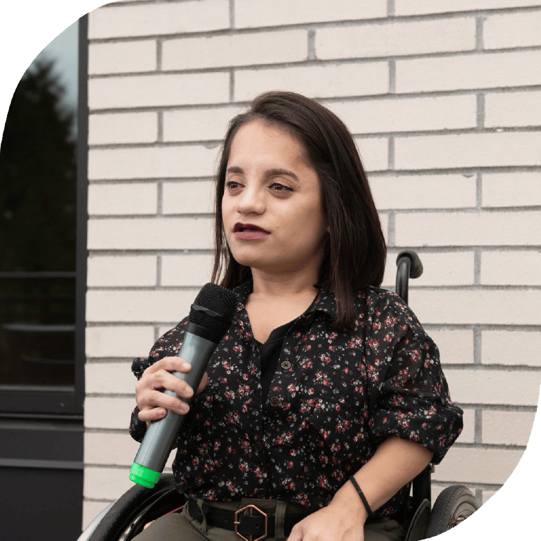 Woman with microphone in wheelchair